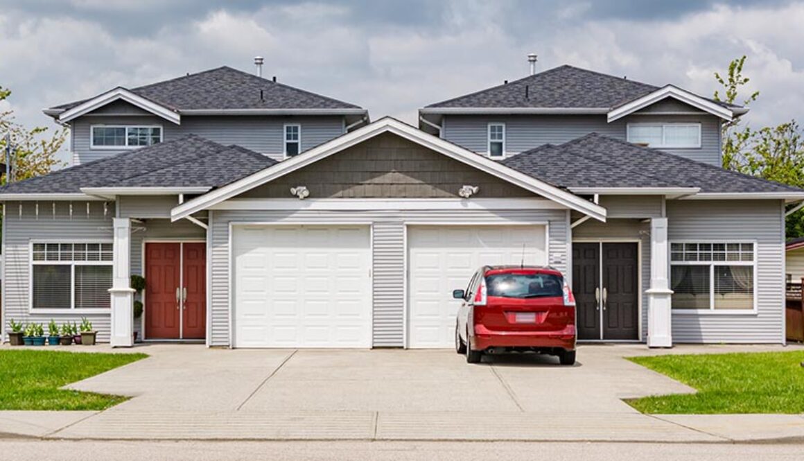 Residential,Duplex,Townhouse,With,Red,Car,Parked,On,Concret,Driveway